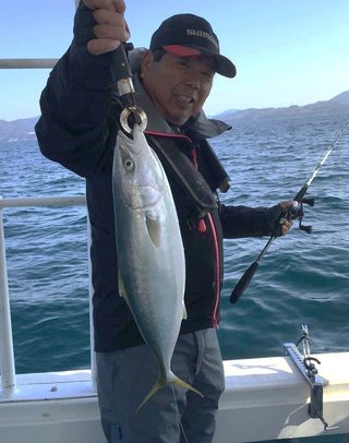 青物と釣り人の写真