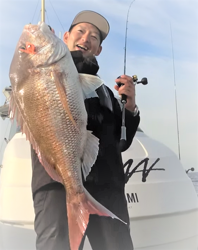 魚と釣り人のアップ写真