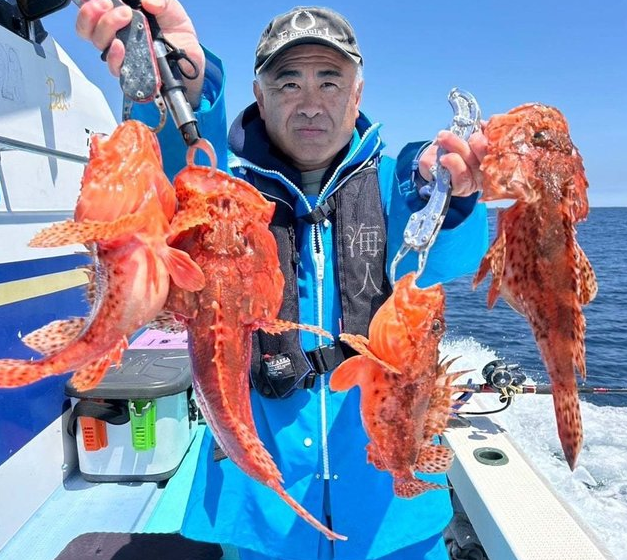 魚と釣り人のアップ写真