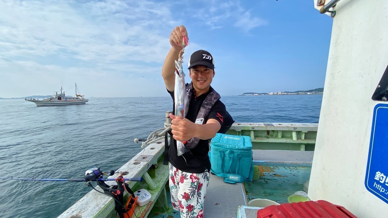 釣り人とスルメイカの写真